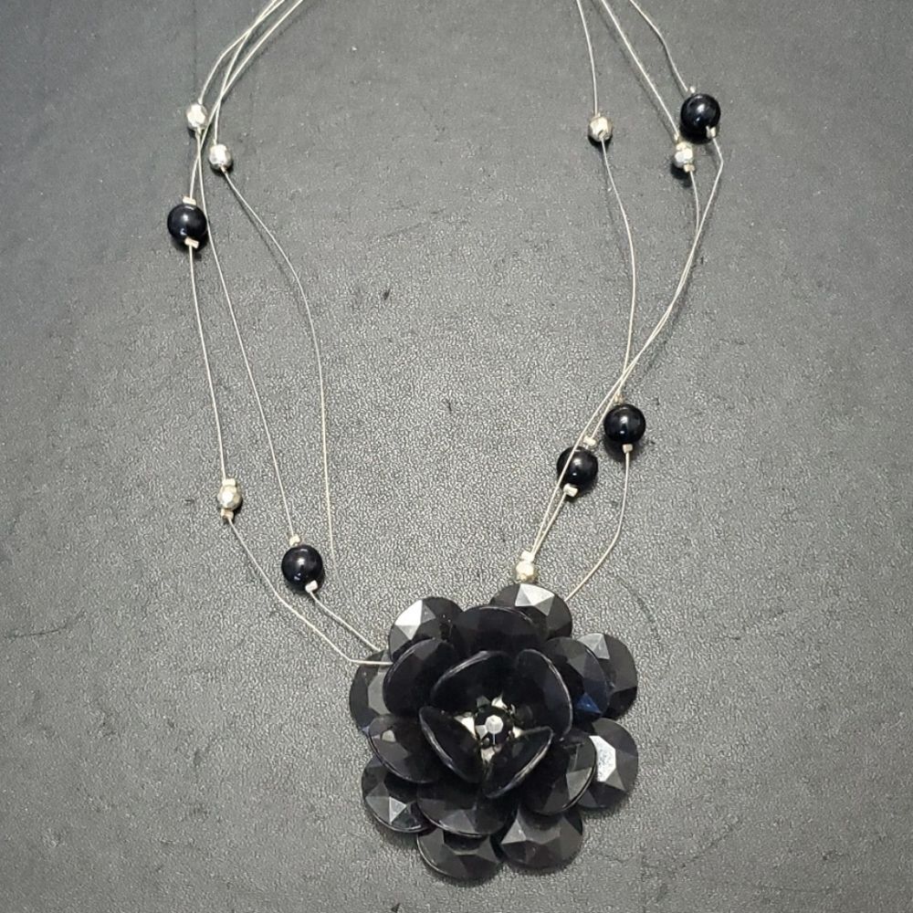 Silver tone black flower floating necklace 18-20"